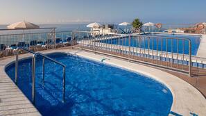Outdoor pool, pool umbrellas, pool loungers