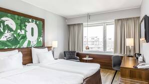 Hypo-allergenic bedding, desk, laptop workspace, blackout curtains