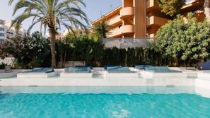 Seasonal outdoor pool, pool umbrellas, pool loungers