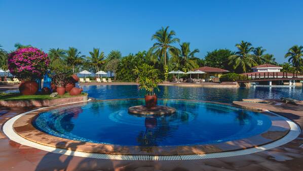 Outdoor pool, open 7:00 AM to 7:00 PM, pool umbrellas