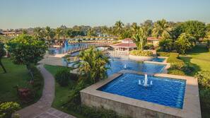 Outdoor pool, open 7:00 AM to 7:00 PM, pool umbrellas