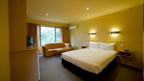 Premium bedding, desk, laptop workspace, blackout curtains