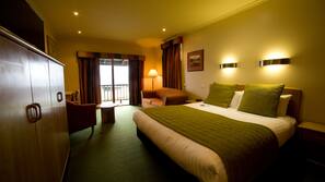 Premium bedding, desk, laptop workspace, blackout curtains