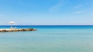 Private beach, beach umbrellas, beach towels, beach bar