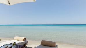 Private beach, beach umbrellas, beach towels, beach bar