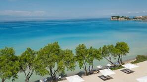Private beach, beach umbrellas, beach towels, beach bar