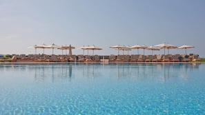Indoor pool, outdoor pool, pool umbrellas, sun loungers