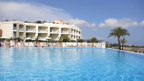 Seasonal outdoor pool, pool umbrellas, pool loungers