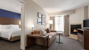 Desk, laptop workspace, blackout drapes, iron/ironing board