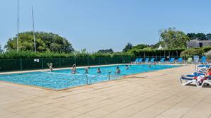 Seasonal outdoor pool, pool umbrellas, pool loungers