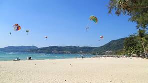 Beach nearby, white sand, beach towels
