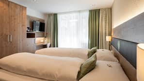 Premium bedding, down comforters, in-room safe, desk