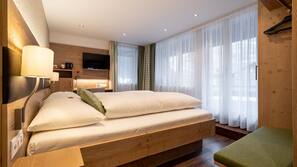 Premium bedding, down comforters, in-room safe, desk