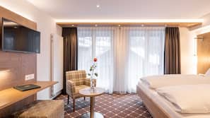 Premium bedding, down comforters, in-room safe, desk
