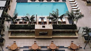 Outdoor pool, open 5:00 AM to 10:00 PM, pool loungers