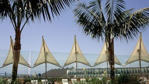 Outdoor pool, open 5:00 AM to 10:00 PM, pool loungers