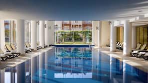 Indoor pool, seasonal outdoor pool, pool umbrellas, pool loungers
