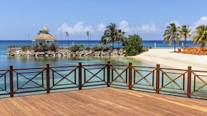 On the beach, white sand, sun loungers, beach umbrellas