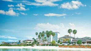 On the beach, white sand, sun loungers, beach umbrellas