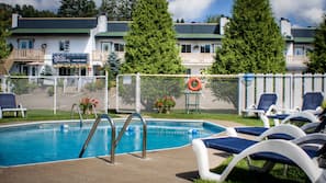 Outdoor pool, open 9 AM to 9 PM, pool umbrellas