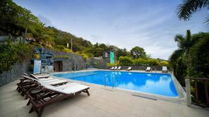 Outdoor pool, pool umbrellas, sun loungers