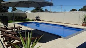 Outdoor pool, pool umbrellas, pool loungers