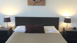 Minibar, desk, blackout curtains, iron/ironing board