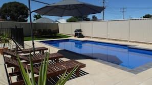Outdoor pool, pool umbrellas, pool loungers