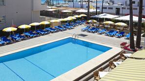 Seasonal outdoor pool, pool umbrellas, pool loungers