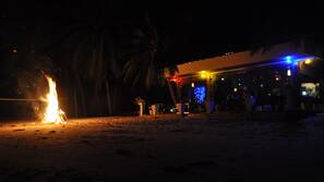 On the beach, white sand, sun-loungers, beach volleyball