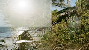 On the beach, white sand, sun-loungers, beach towels