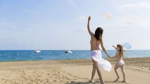 Private beach, free beach shuttle, sun loungers, beach umbrellas