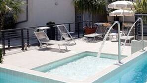 Outdoor pool, pool umbrellas, pool loungers