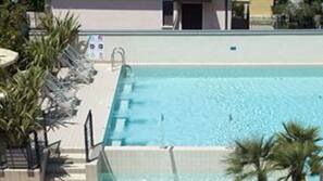 Outdoor pool, pool umbrellas, pool loungers