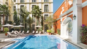 Outdoor pool, open 8:00 AM to 8:00 PM, sun loungers