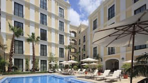 Outdoor pool, open 8:00 AM to 8:00 PM, sun loungers