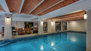 Indoor pool, pool umbrellas, sun loungers