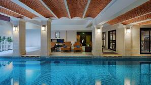 Indoor pool, pool umbrellas, sun loungers