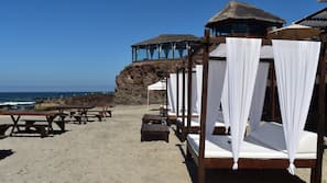 On the beach, beach towels, beach massages, beach bar