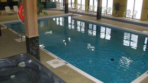 Seasonal outdoor pool, open 10:00 AM to 10:00 PM, pool umbrellas