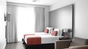 Premium bedding, down comforters, pillowtop beds, in-room safe