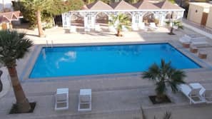 Outdoor pool, pool umbrellas, sun loungers