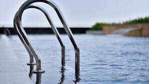 Outdoor pool, open 6:00 AM to 10:00 PM, pool umbrellas, pool loungers