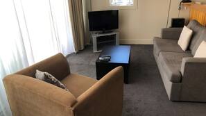 32-inch flat-screen TV with cable channels, DVD player