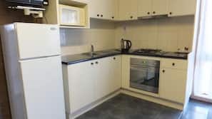 Fridge, microwave, coffee/tea maker, cookware/dishes/utensils