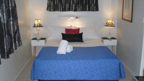 Blackout curtains, iron/ironing board, free WiFi, linens