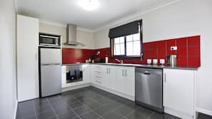Full-size fridge, microwave, stovetop, dishwasher