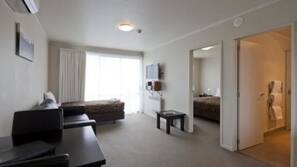 Premium bedding, blackout curtains, iron/ironing board, free WiFi