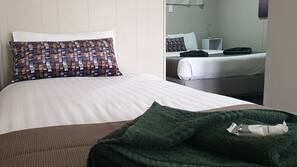 Desk, blackout curtains, iron/ironing board, rollaway beds