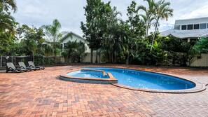 Outdoor pool, open 7:00 AM to 8:00 PM, pool loungers